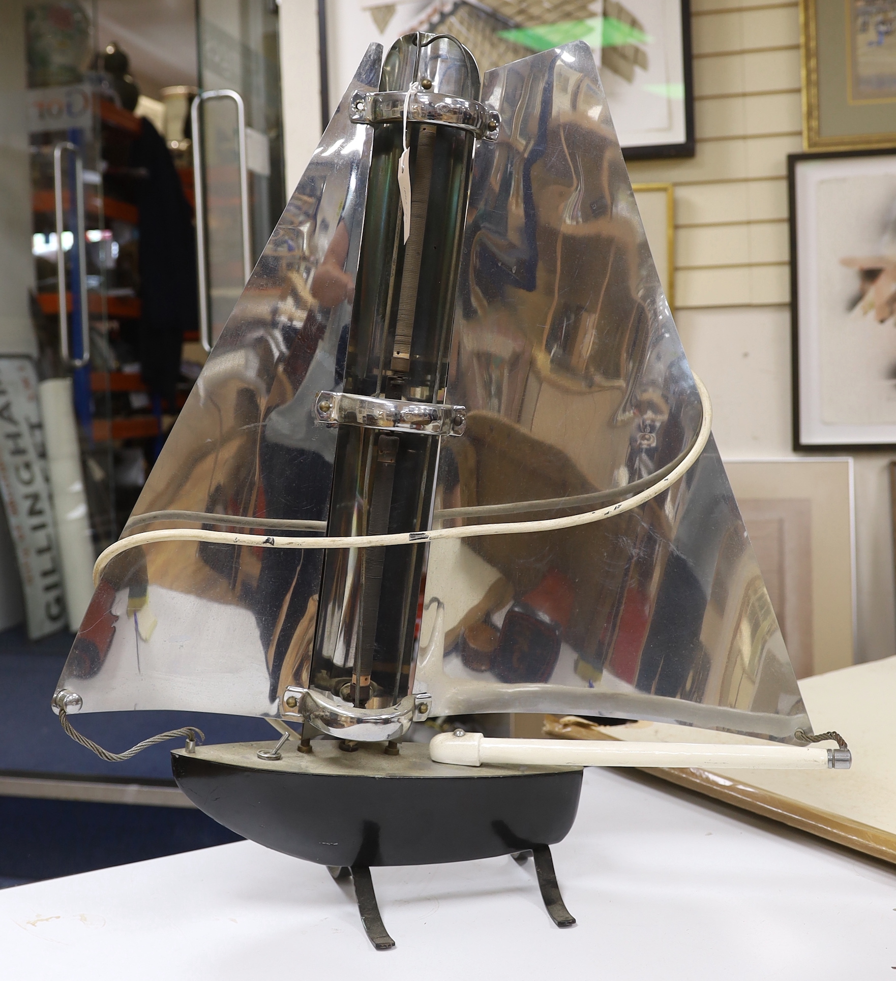 An Art Deco novelty yacht shaped chrome and black enamelled metal electric fire, by Bunting, 75cm high